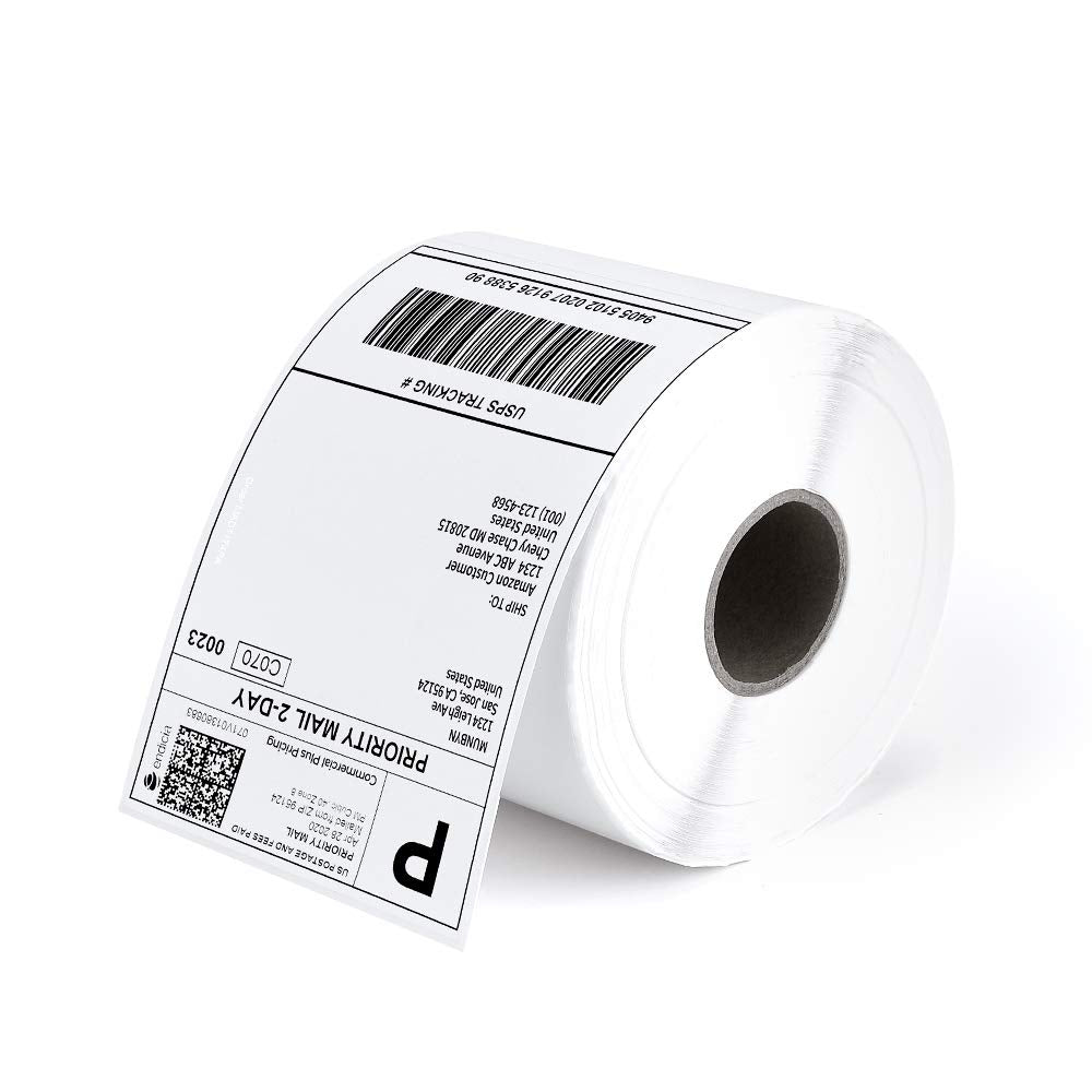 Roll of thermal shipping labels with printed barcode and address, used for package labeling