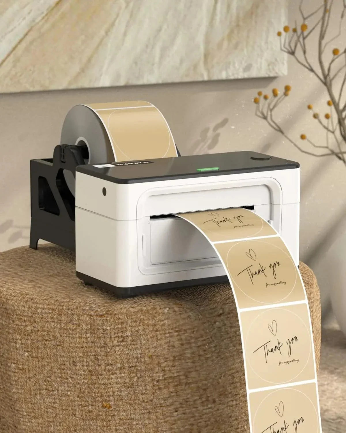 Thermal label printer printing beige thank you stickers for shipping and packaging