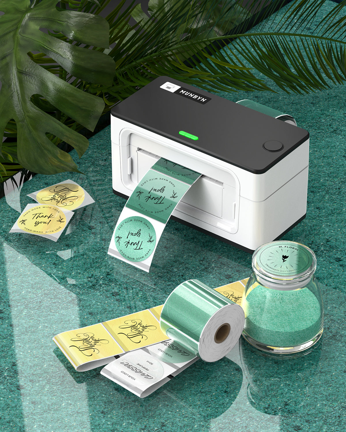 Thermal label printer on green surface printing glitter thank you stickers with label rolls.