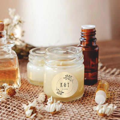Custom round label on glass jar of cream with botanical elements, next to oil bottles