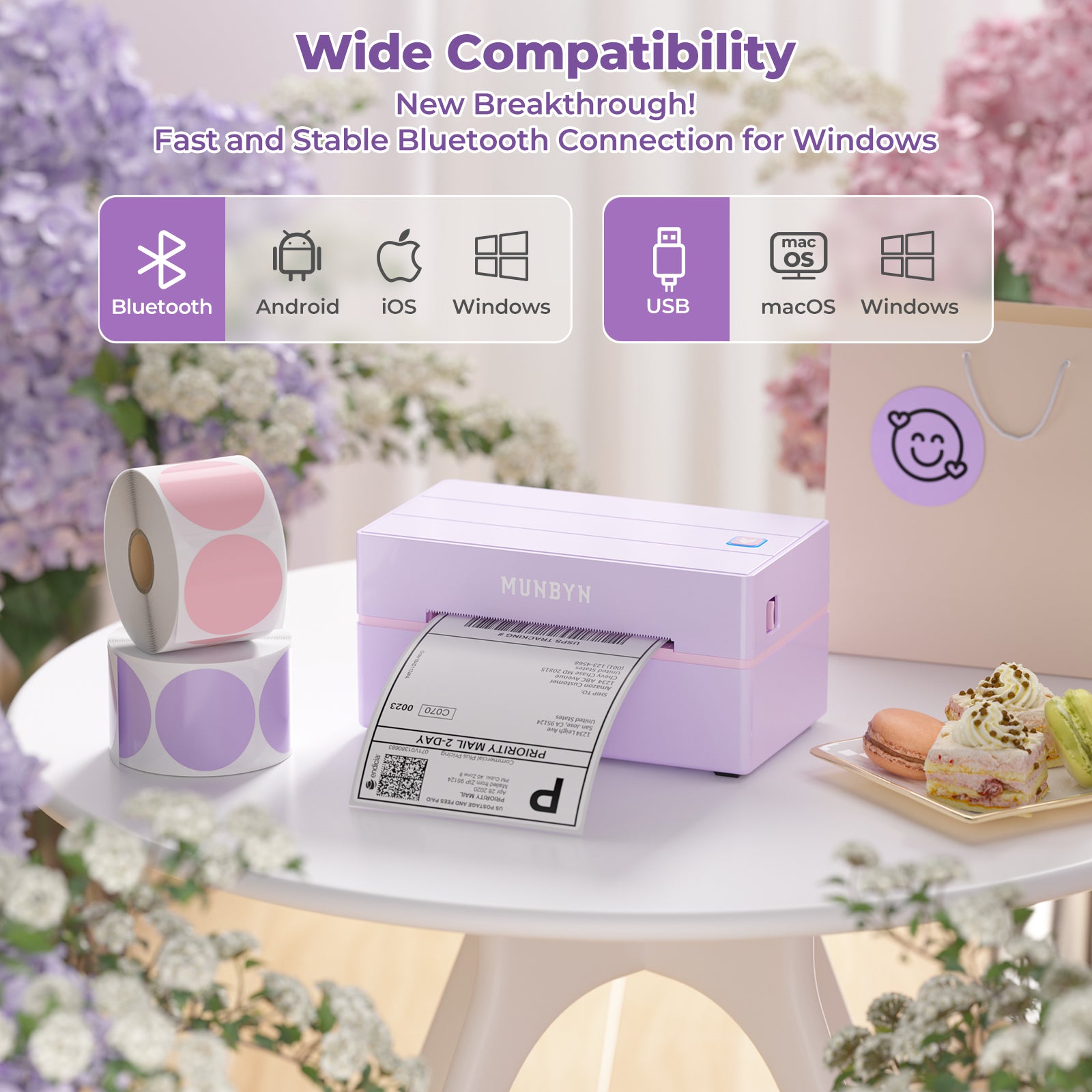 Pastel thermal label printer printing shipping label, with colored label rolls on desk, flowers and desserts nearby.