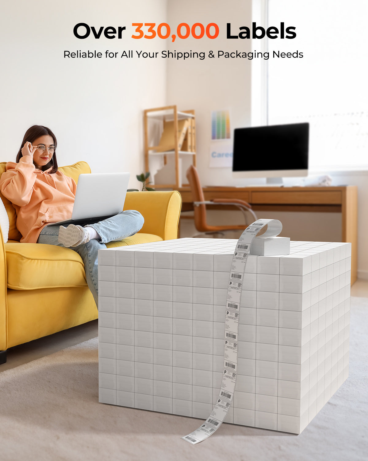 Woman on yellow sofa working on laptop next to large stack of shipping labels, home office setup