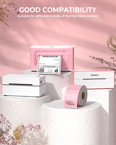 Assorted pink and white thermal printers with label rolls on display pedestals, shipping labels visible.