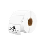 White thermal label roll with rectangular blank stickers for shipping and packaging