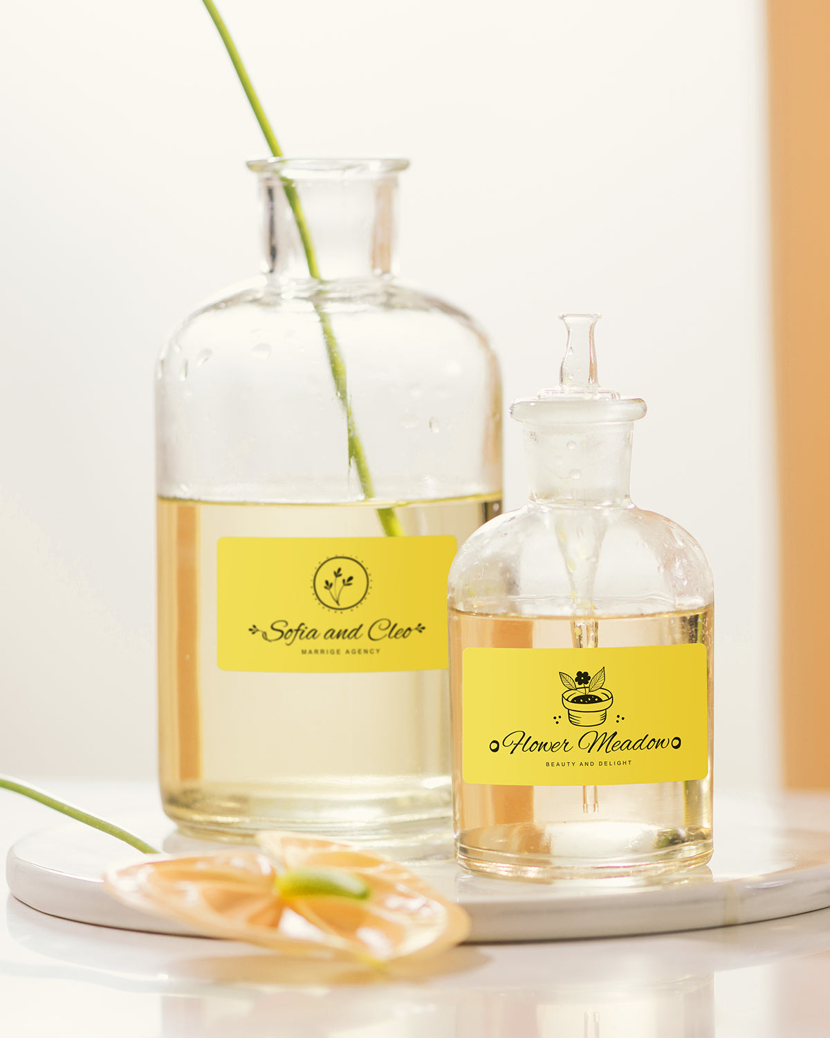 Clear glass bottles with yellow product labels for jars, ideal for custom packaging or organization.