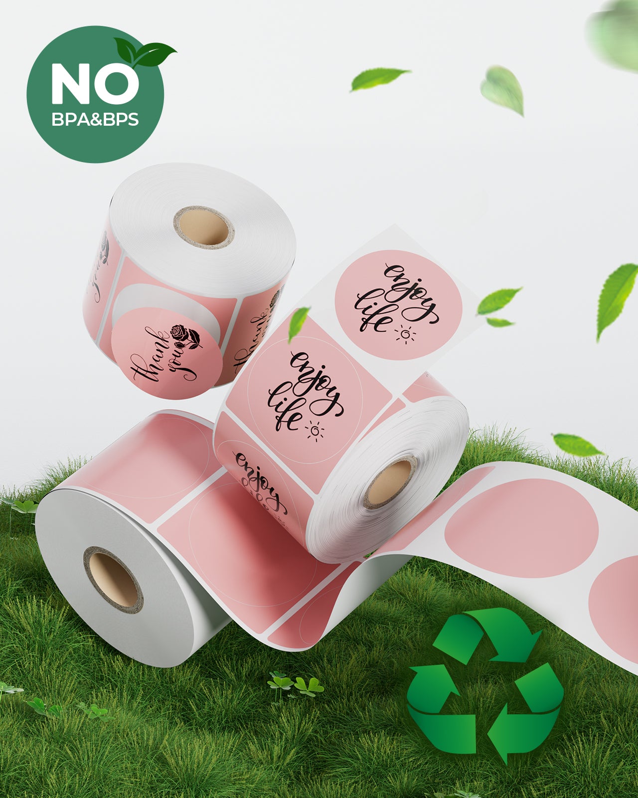 Eco-friendly pink round thermal label rolls with 'Thank you' and 'enjoy life' text, BPA free, on grass