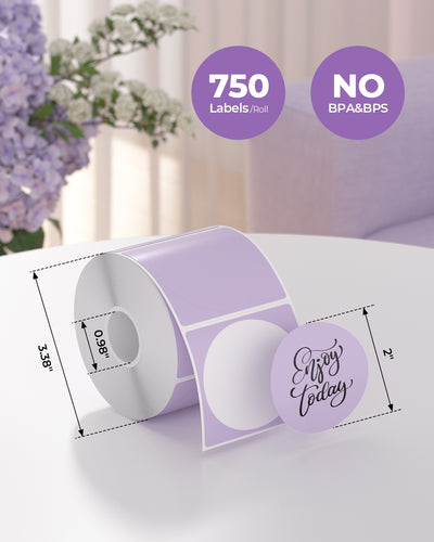 Roll of 2x2 inch round thermal labels, 750 per roll, BPA and BPS free, on a table.