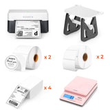 Thermal label printer kit with printer, label holder, shipping labels, thank you stickers, and pink digital scale.