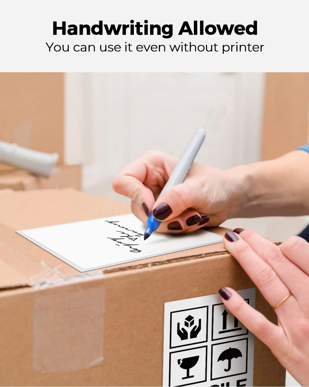 Handwriting on adhesive shipping label attached to cardboard box for packaging