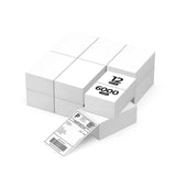 Twelve stacks of white thermal shipping labels, 6000 total, with one printed label visible.