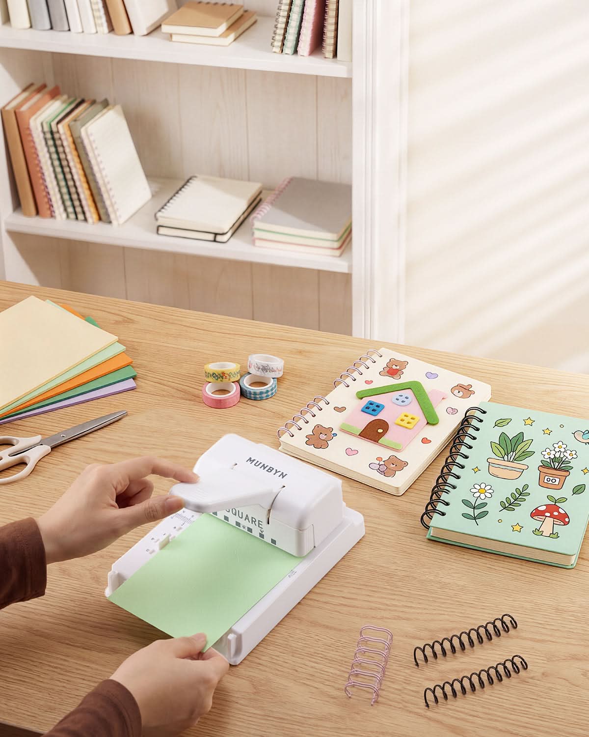 White MUNBYN FB001 multi binding machine with binding combs and controls for professional document binding.