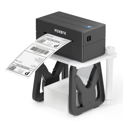 Black thermal label printer printing shipping label, shown on a white and black holder.