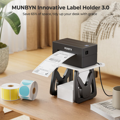 Black thermal label printer with innovative label holder and label rolls on a wooden desk