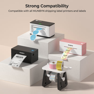 Thermal shipping label printers in black, white, and pink with label rolls on display stands.