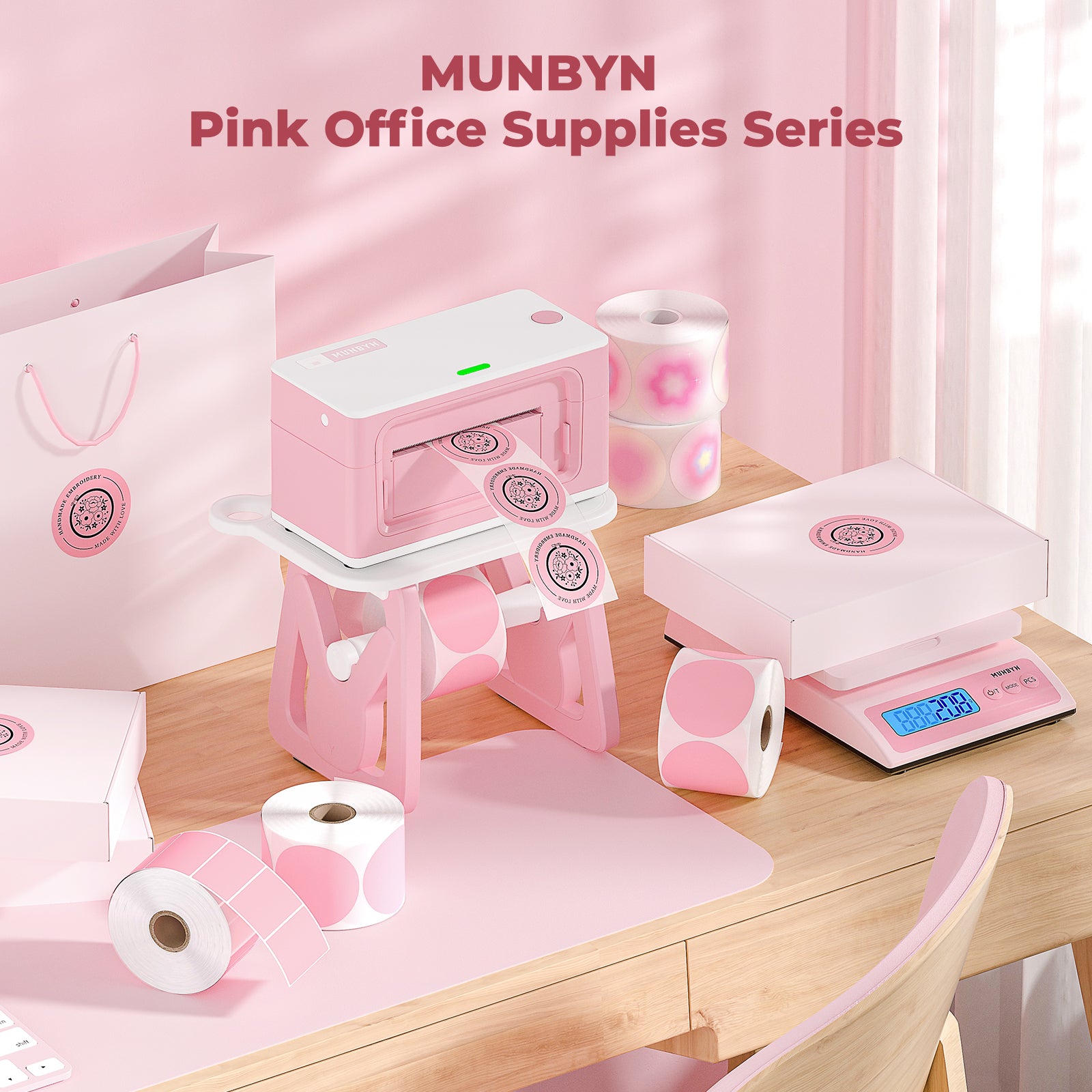 Pink thermal printer, scale, and labels set on a pastel office desk, pink office supplies theme