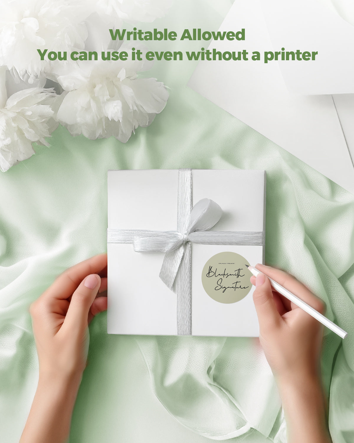 Writable round label on white gift box with ribbon, hand writing with pen, elegant setting