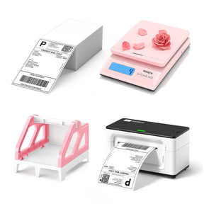 The MUNBYN white thermal printer kit includes a stack of shipping labels, a pink postage scale, a pink label holder and a white thermal printer.