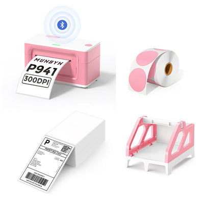 The MUNBYN 941B pink Bluetooth label printer kit includes a printer, a roll of circle labels, a pink label holder, and a stack of shipping labels