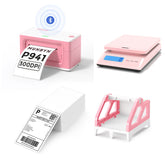 The MUNBYN 941B pink Bluetooth label printer kit includes a printer, a shipping scale, a label holder, and a stack of shipping labels