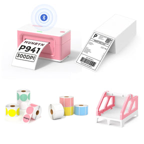 The MUNBYN 941B pink Bluetooth label printer kit includes a printer, a label roll holder, eight rolls of coloured labels, and a stack of shipping labels