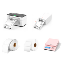 The white 4x6 thermal printer kit includes two rolls of blank labels, a stack of shipping labels, a pink postage scale and a white thermal printer.
