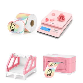 The pink printer color label kit includes a roll of colorful scalloped labels, a postage scale, a pink printer and a label holder.