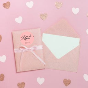 50mm pink round thermal labels can be used to attach to envelopes. 